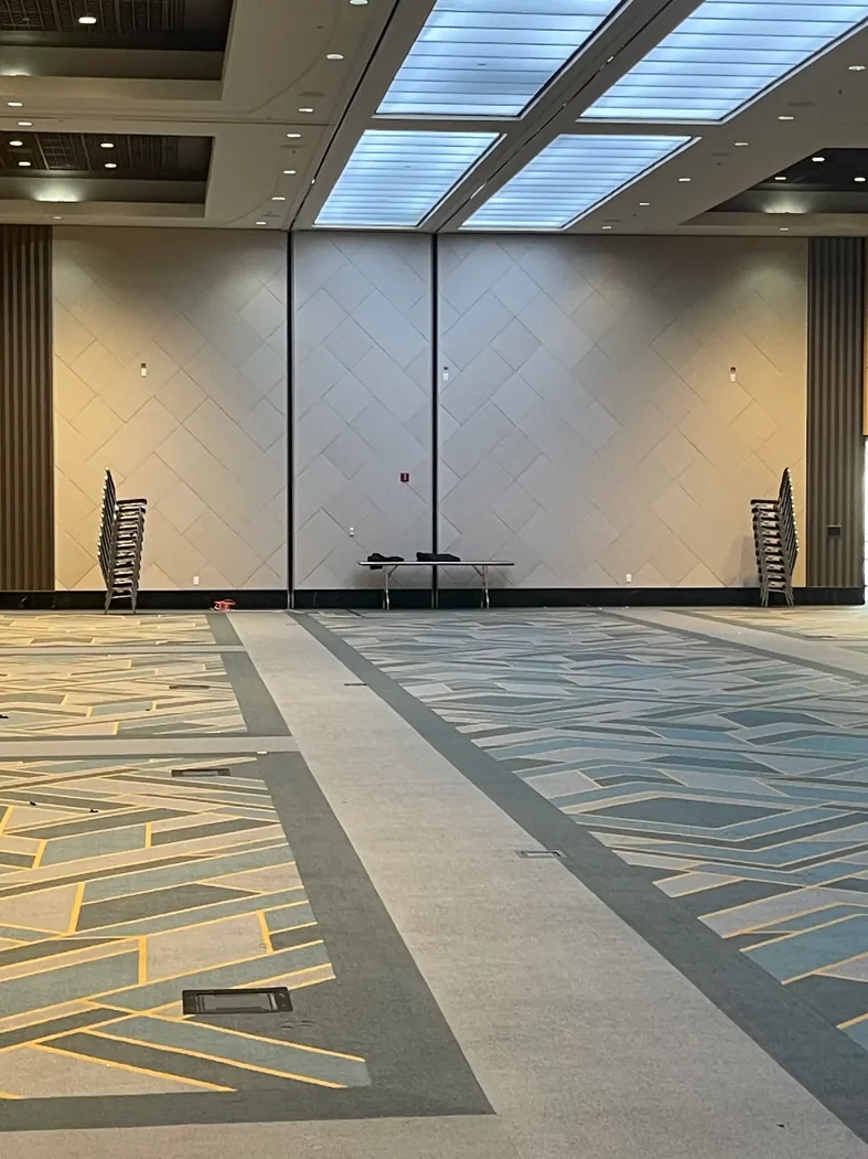 Large custom acoustic wall treatment in a finished commercial interior