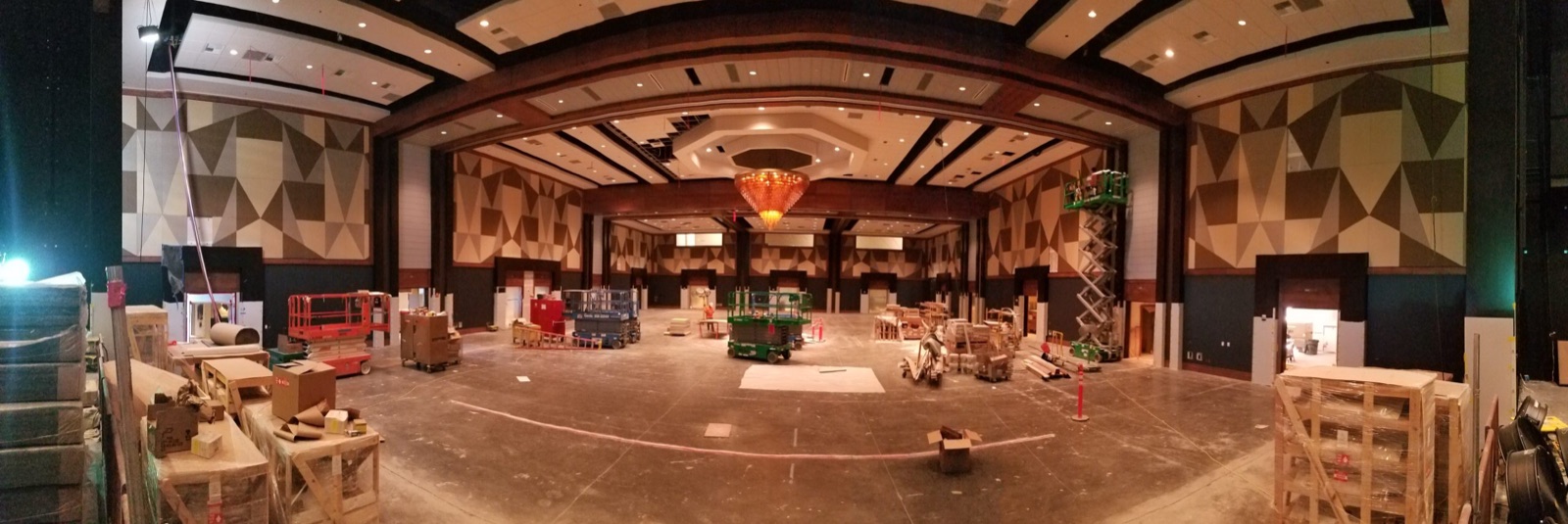 Large performance hall during construction with faceted acoustic wall surfaces